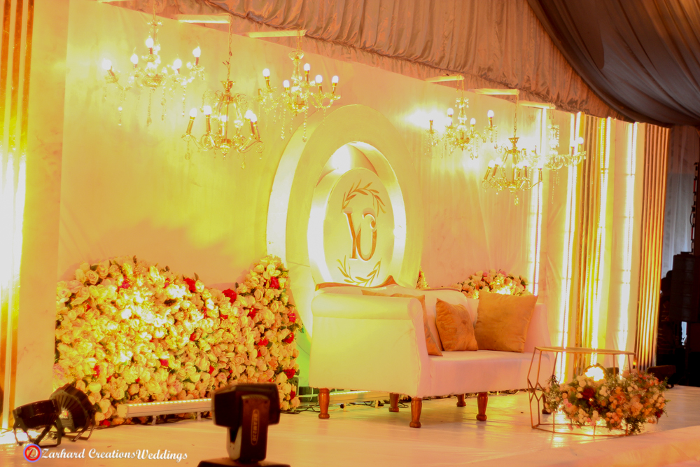 marquee tent venue event center in Lagos, event wedding stage design, signage, chandelier, moving head, couple head table, couple sofa, wedding decorator, event decorator in Nigeria,