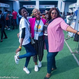 wealth summit conference with Olumide emmanuel, Wisdom Ezekiel, exhibition booths, outdoor event with green astroturfreal money of Lagos,