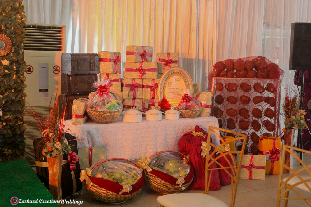 Yetunde and Femi Traditional Wedding, eru iyawo set up for traditional engagement, yam n rack, boxes, baskets, palm oil, gift items for yoruba traditional wedding