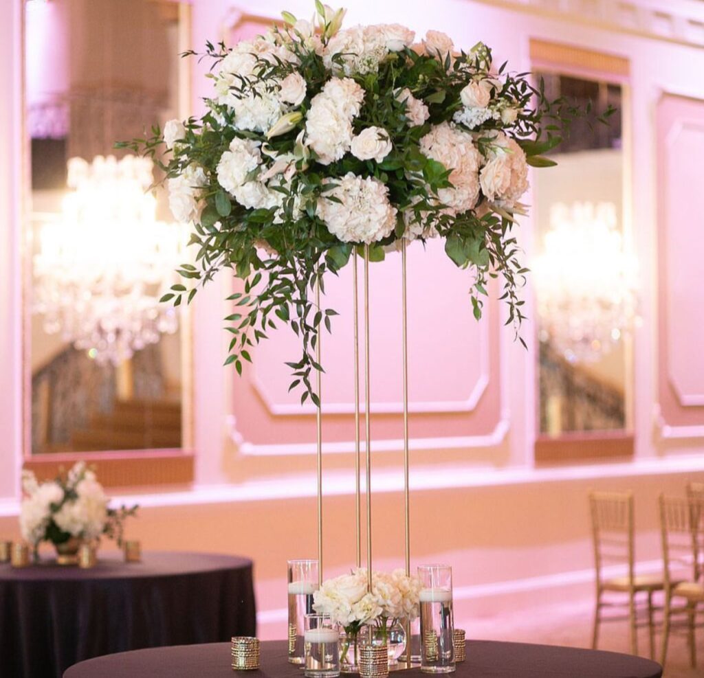 centerpieces with white, green floral arrangement