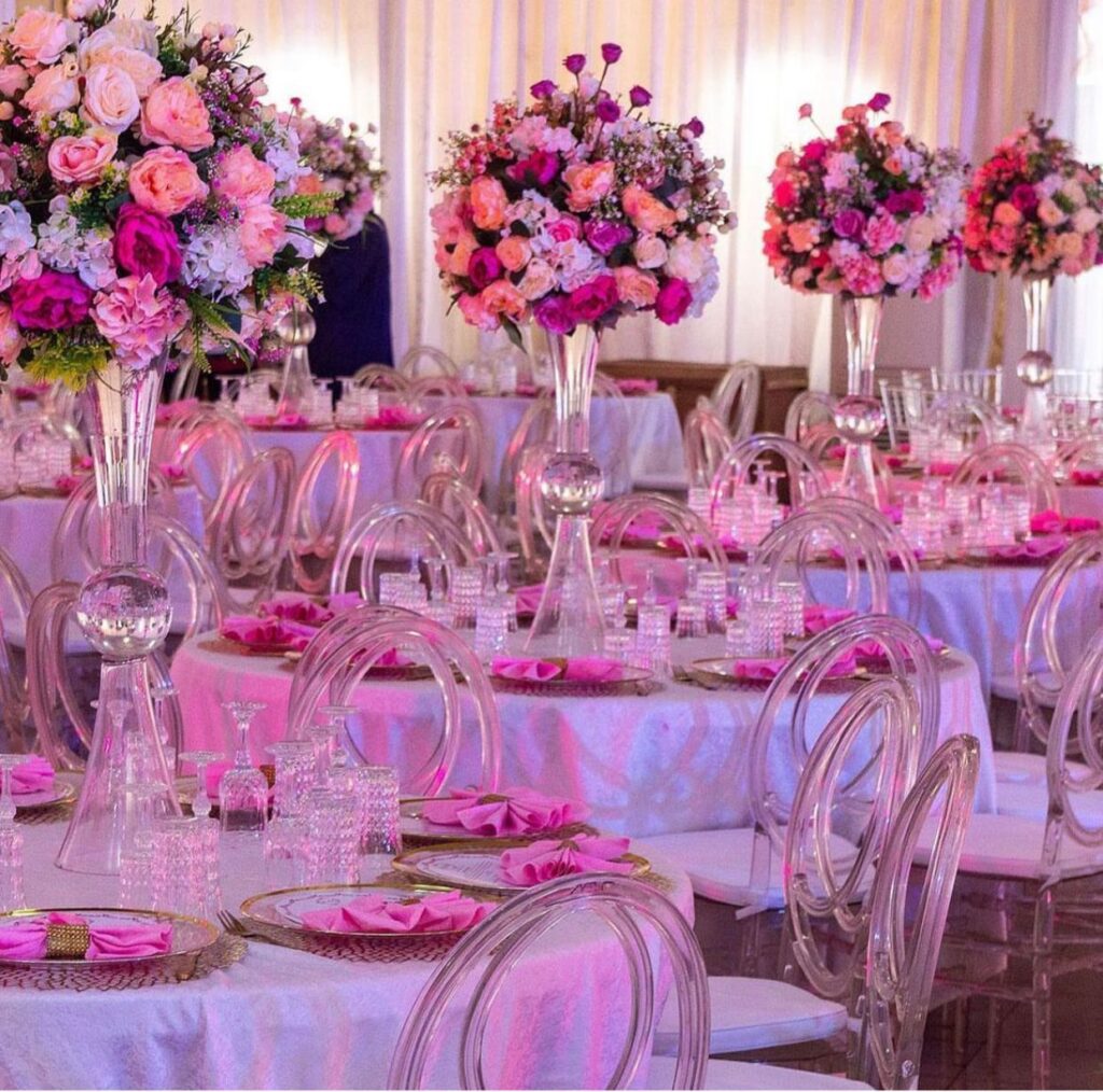 clear glass centerpieces, pink flowers with white, peach floral arrangement