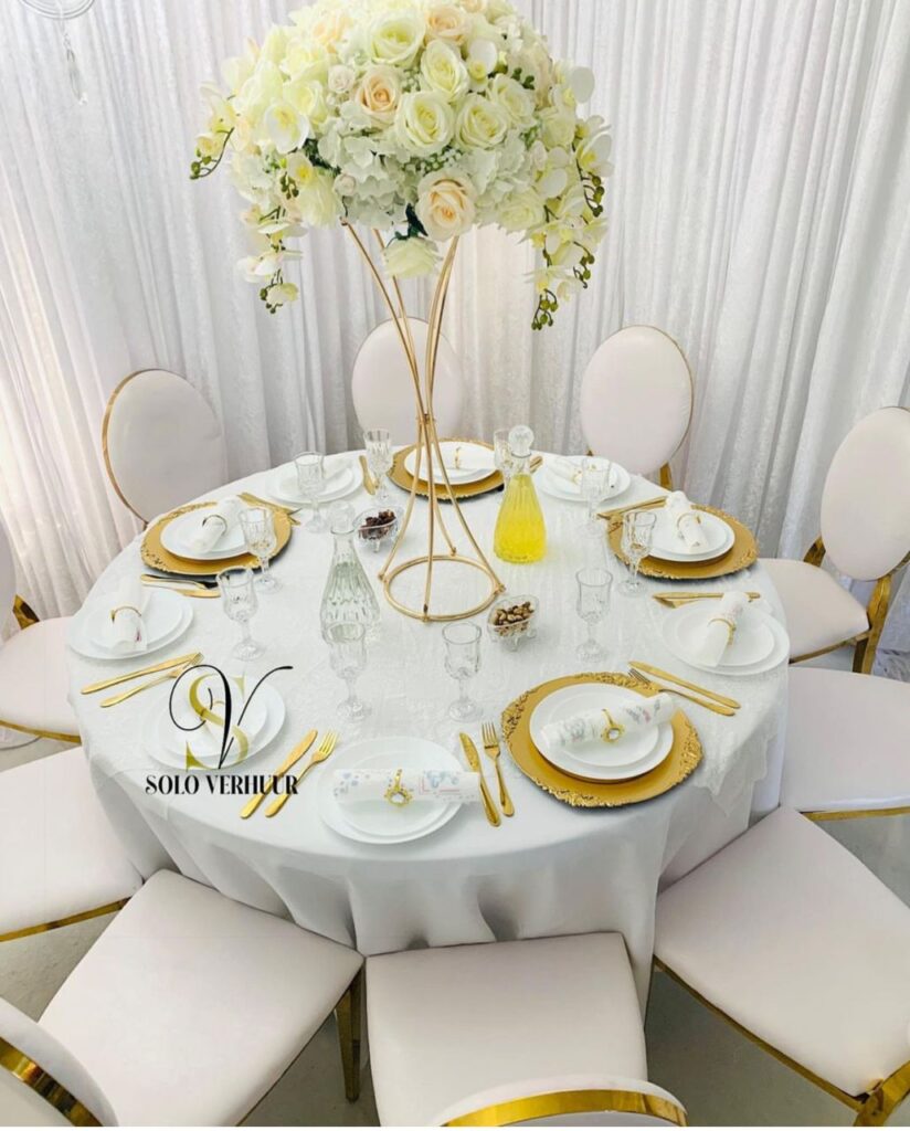 centerpieces with white, yellow, gold floral arrangement