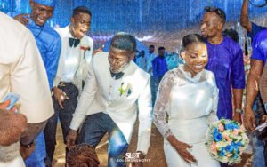 Nigerian couple white wedding gown and white suit wedding day photoshoot reception grand entrance dance, blue wedding color groomsmen and bridesmaids