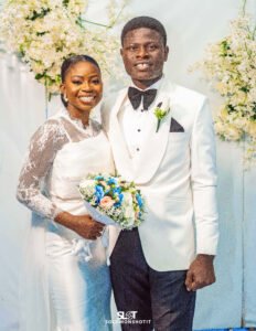 Nigerian couple white wedding gown and white suit wedding day photoshoot, wedding bouquet, white and black wedding outfit for groom, ivory bridal gown