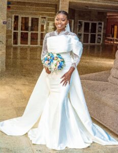 Nigerian couple white wedding gown and white suit wedding day photoshoot, wedding bouquet, white and black wedding outfit for groom, ivory bridal gown, wedding portrait