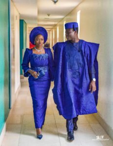 Nigerian couple yoruba traditional wedding photoshoot, prewedding shoot, portrait photography, blue agbada, aso oke, gele, attire and outfit. Yoruba fila