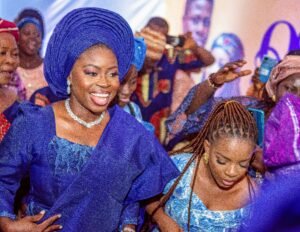 Nigerian couple yoruba traditional wedding photoshoot, prewedding shoot, portrait photography, blue agbada, aso oke, gele, attire and outfit. Yoruba fila, bride entrance