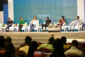 The WorkPlace Outlook conference planning in lagos, white bucket chairs with stools, panel session, screen, corporate event stage set up