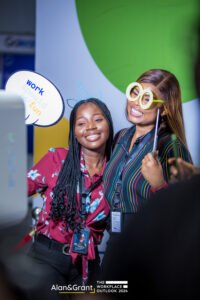 Photobooth and props, stage design with LED screen, stage props, banners, lounges, white couch, side stools event planner