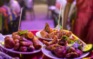 Enriching Small chops with chicken, puff puff, garnish