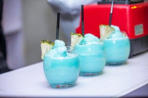 blue frozen cocktails with garnish and straw for corporate and social event