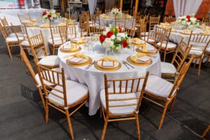 Construction company PERI Open day and 10th year anniversary, corporate events, corporate event planner in Lagos, Nigeria, white, red and yellow florals for centerpieces, table setting